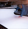 Caldwell insulation being installed in a crawl space.