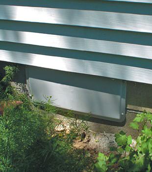 A gray crawl space vent cover in Burley