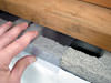 Clear plastic vapor barrier covering for block walls in Rigby