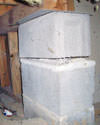 Concrete crawl space support posts in Jerome that are showing signs of failure as they sink into the earth.