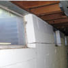 A foundation showing severe inward buckling along the windows in a Sandpoint home.