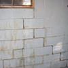A cracked foundation wall near a window in a Rigby home