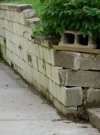 collapsing retaining wall with severe damage in Rupert