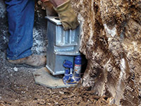 Securing a foundation footing bracket for a foundation repair system in Moscow.