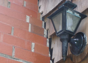 A tilting chimney in Burley showing serious foundation damage.