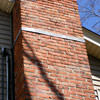A tilting chimney on a Preston home with a leaning, tilting chimney that was temporarily repaired.
