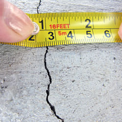 A crack in a poured concrete wall that's showing a normal crack during curing in Buhl
