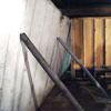 Temporary foundation wall supports stabilizing a Meridian home