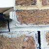 Failed crack repair showing old tuckpointing that cracked on a Pocatello home.