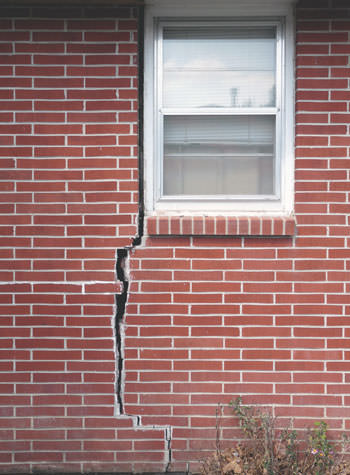 severe foundation wall cracks along a window in Rigby