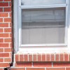 A gap in a window along the outer wall due to foundation settlement of a Ontario home.