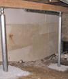 A system of crawl space support posts adding structural support to a crawl space in Buhl