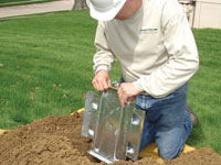 Fastening an earth anchor for a severely bowing wall in Twin Falls.