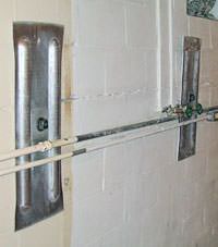 A foundation wall anchor system used to repair a basement wall in Rupert
