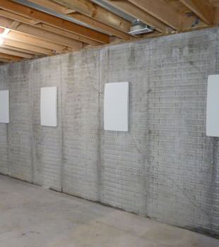 Wall anchor covers covering a foundation wall repair system in Rexburg, Moscow, Blackfoot, Mountain Home, Sandpoint