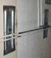 Foundation wall anchor plates installed in a basement in Pocatello