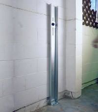 A failing foundation wall repaired with a foundation wall channel anchor system in a Meridian home.
