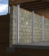 I-beam foundation wall supports installed in a Preston basement.