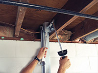 Straightening a foundation wall with the PowerBrace™ i-beam system in a Post Falls home.
