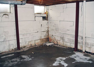A failed, rusty i-beam foundation wall system installed in Mountain Home.