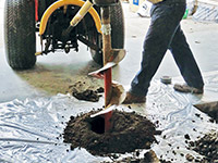 Digging the hole used for wall anchor installation in Emmett.