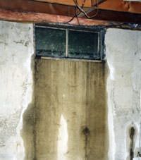 Flooding through basement windows in a Payette home.