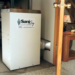 A basement dehumidifier with an ENERGY STAR® rating ducting dry air into a finished area of the basement  in Buhl