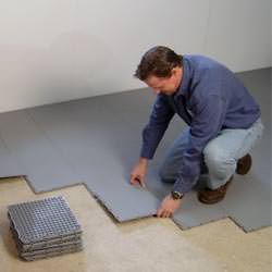 basement subfloor tiles being installed by a contractor in Rathdrum
