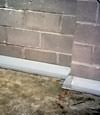 Our baseboard drain system installed on a corner in a Lewiston basement.