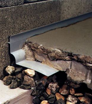 a custom designed basement drain system for thin basement floors in Rigby.