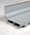A closeup of our FlowGuard drain system for wet basements in Kuna.