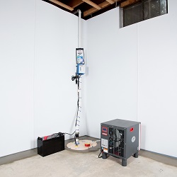 Sump pump system, dehumidifier, and basement wall panels installed during a sump pump installation in Ontario