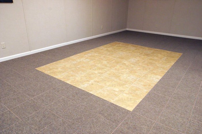 tiled and carpeted basement flooring installed in a Nampa home