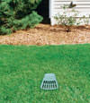 A buried gutter drain downspout extension installed in a Buhl home