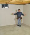 Caldwell basement insulation covered by EverLast™ wall paneling, with SilverGlo™ insulation underneath